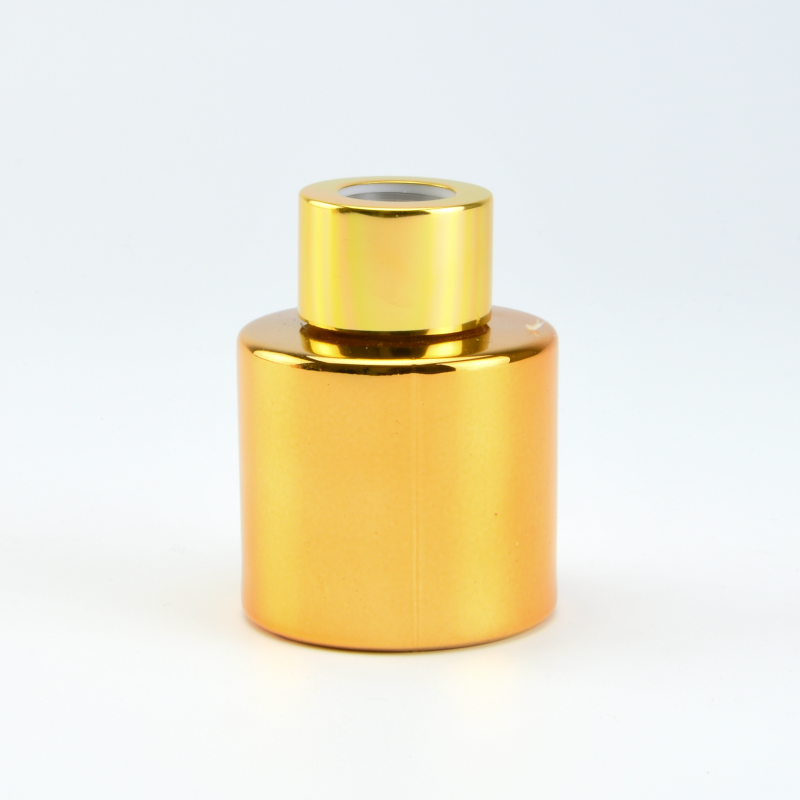 Parfumflesje cylinder goud met gouden schroefdop - 50 ml